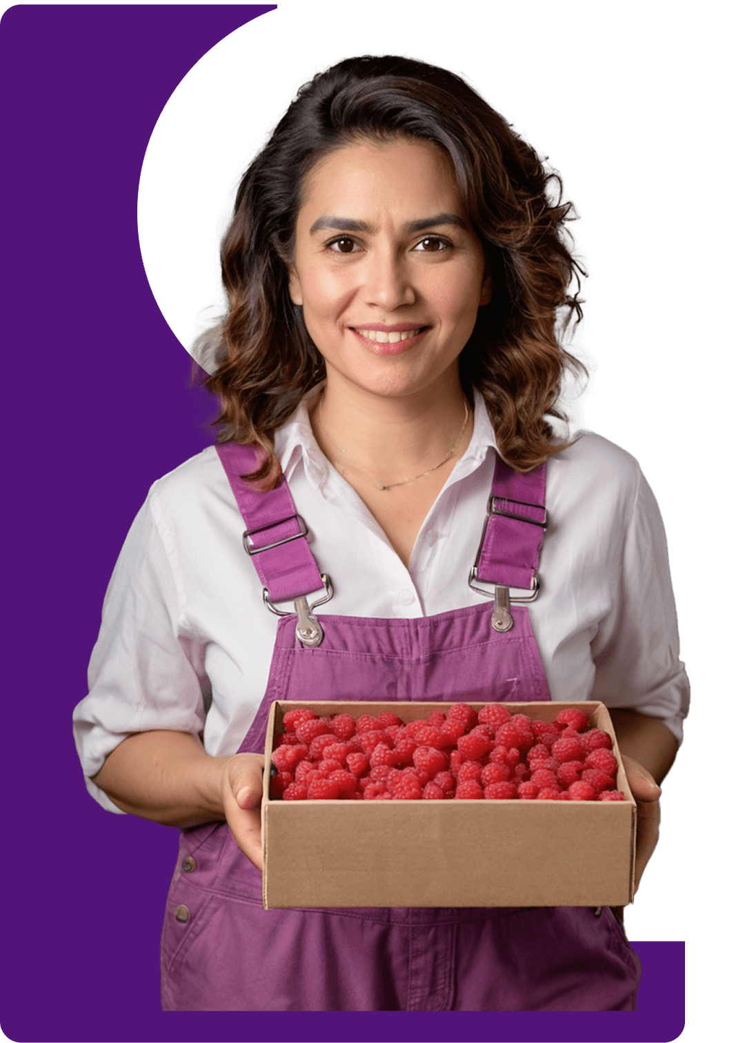 Woman holding box of fresh raspberries